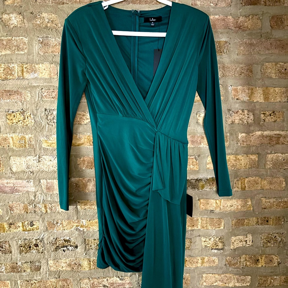 Green dress perfect for the holidays, a cocktail party, or wedding.